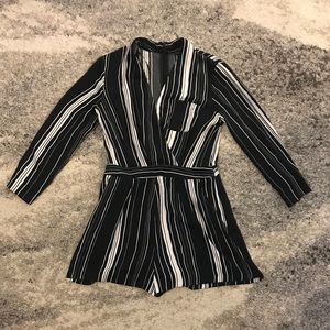 Stripped jumpsuit with front pocket